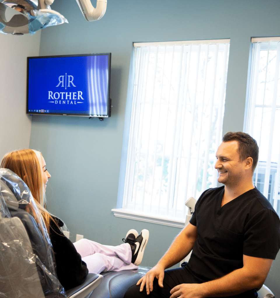 dr rother with a patient at the dental office in mechanicsburg